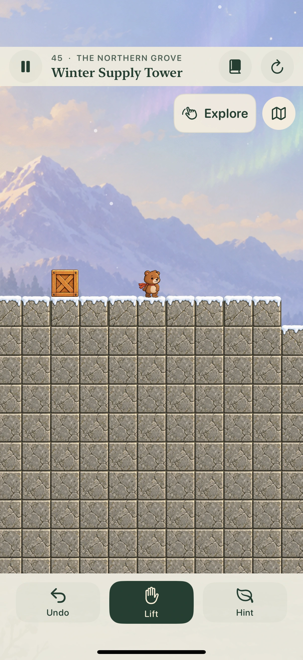 Frostbound gameplay with snow-covered stone, blue ice and wooden crates.